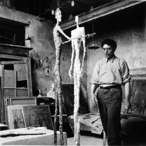 Henri Cartier-Bresson fotografiant Alberto Giacometti a Montparnasse, capturant la solitud de l'artista.